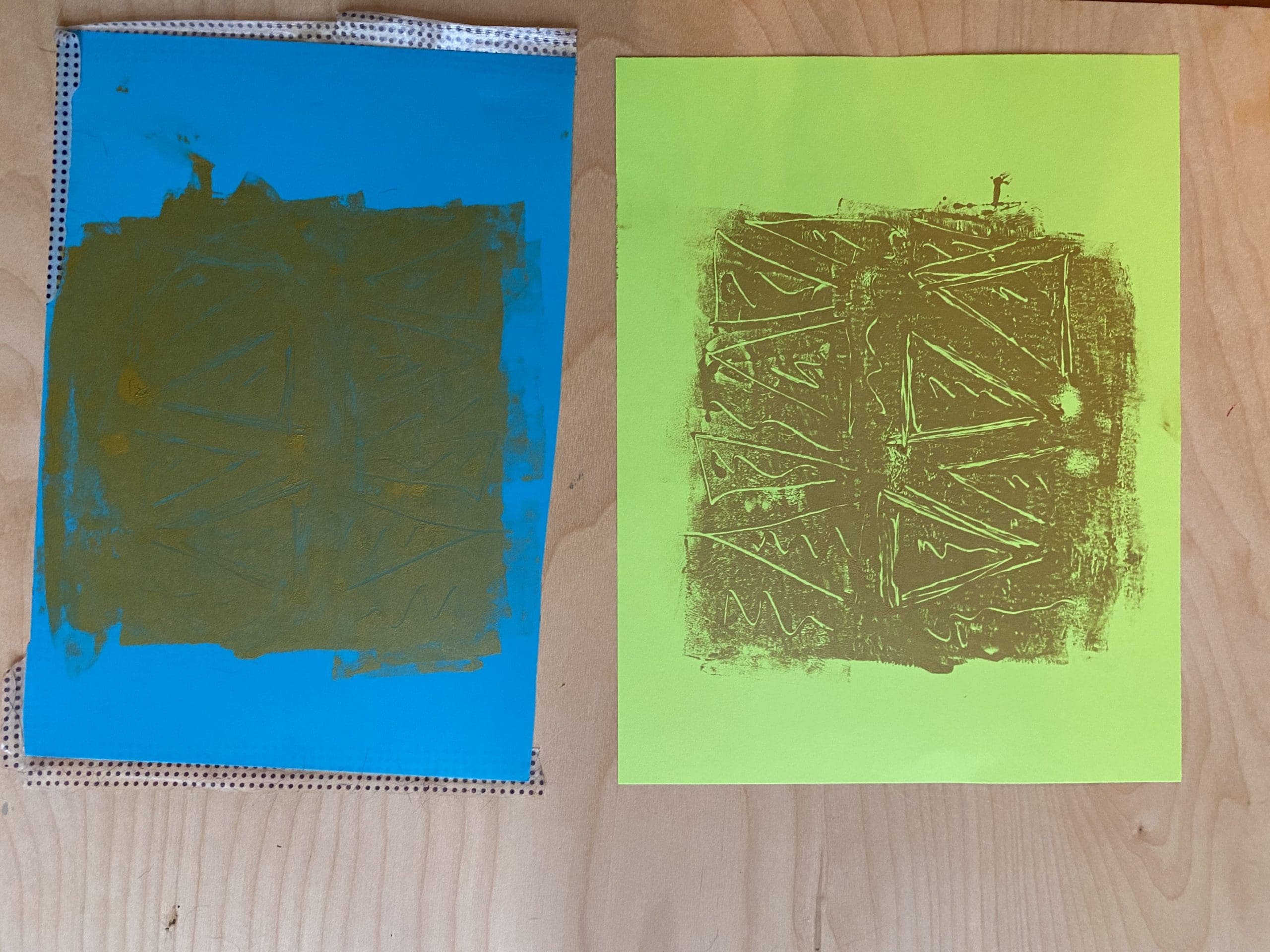 gold colored monoprint on paper next to monoprint plate