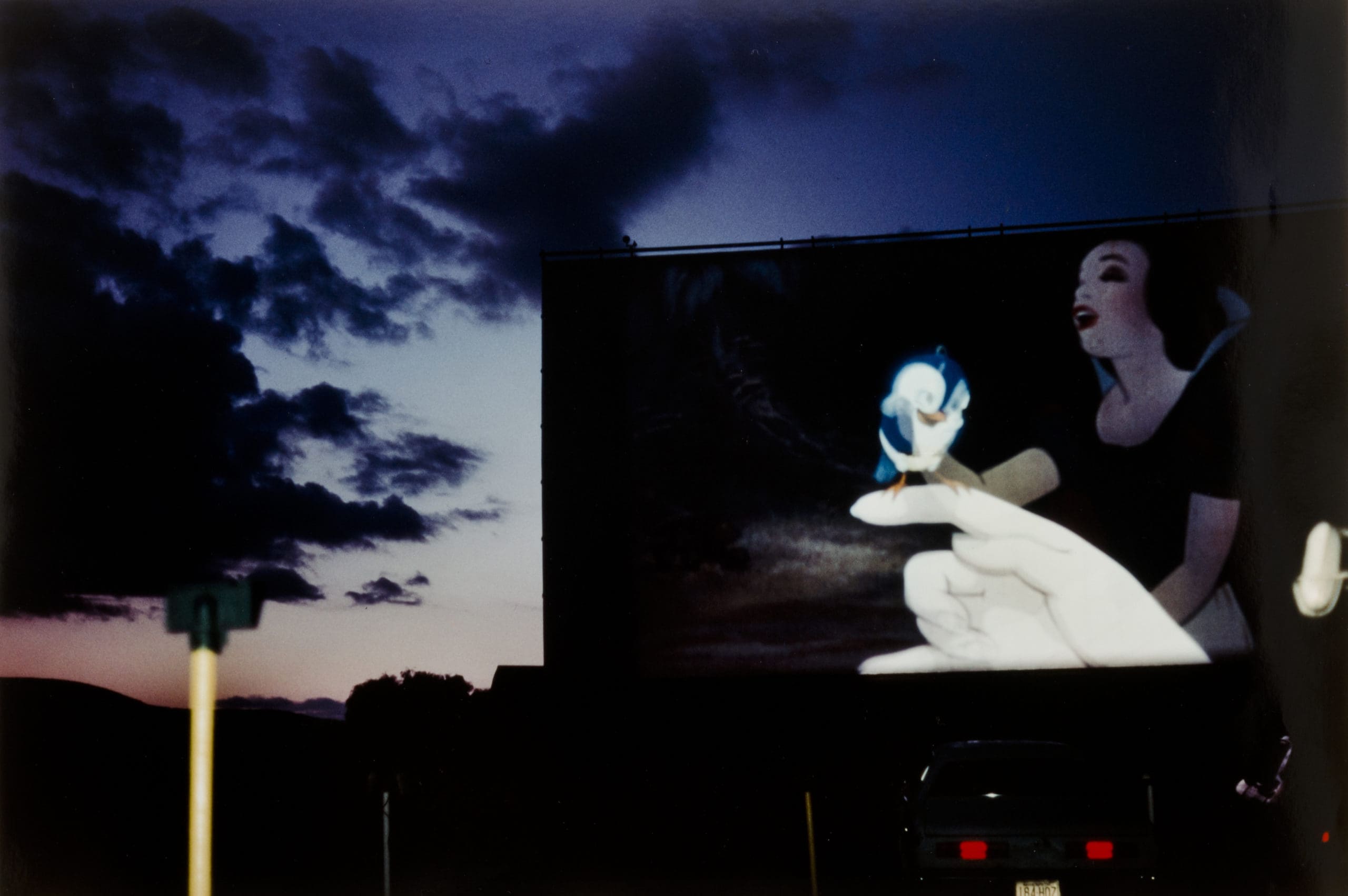 Joan Liftin. "Snow White," Hoosac Drive-in, North Adams, Massachusetts, 1984. Gift of Helen Levitt 1998.45