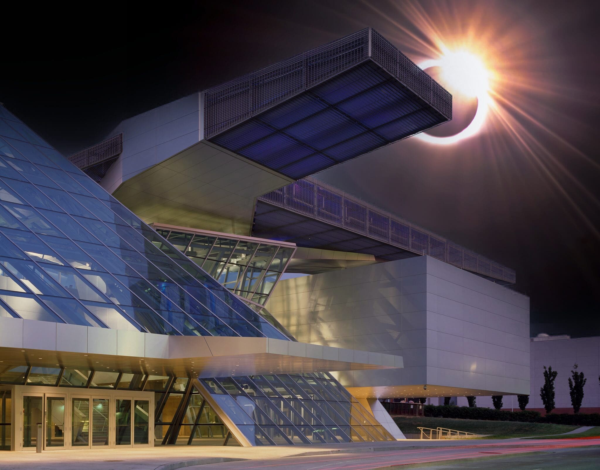Graphic of a solar eclipse over the Akron Art Museum