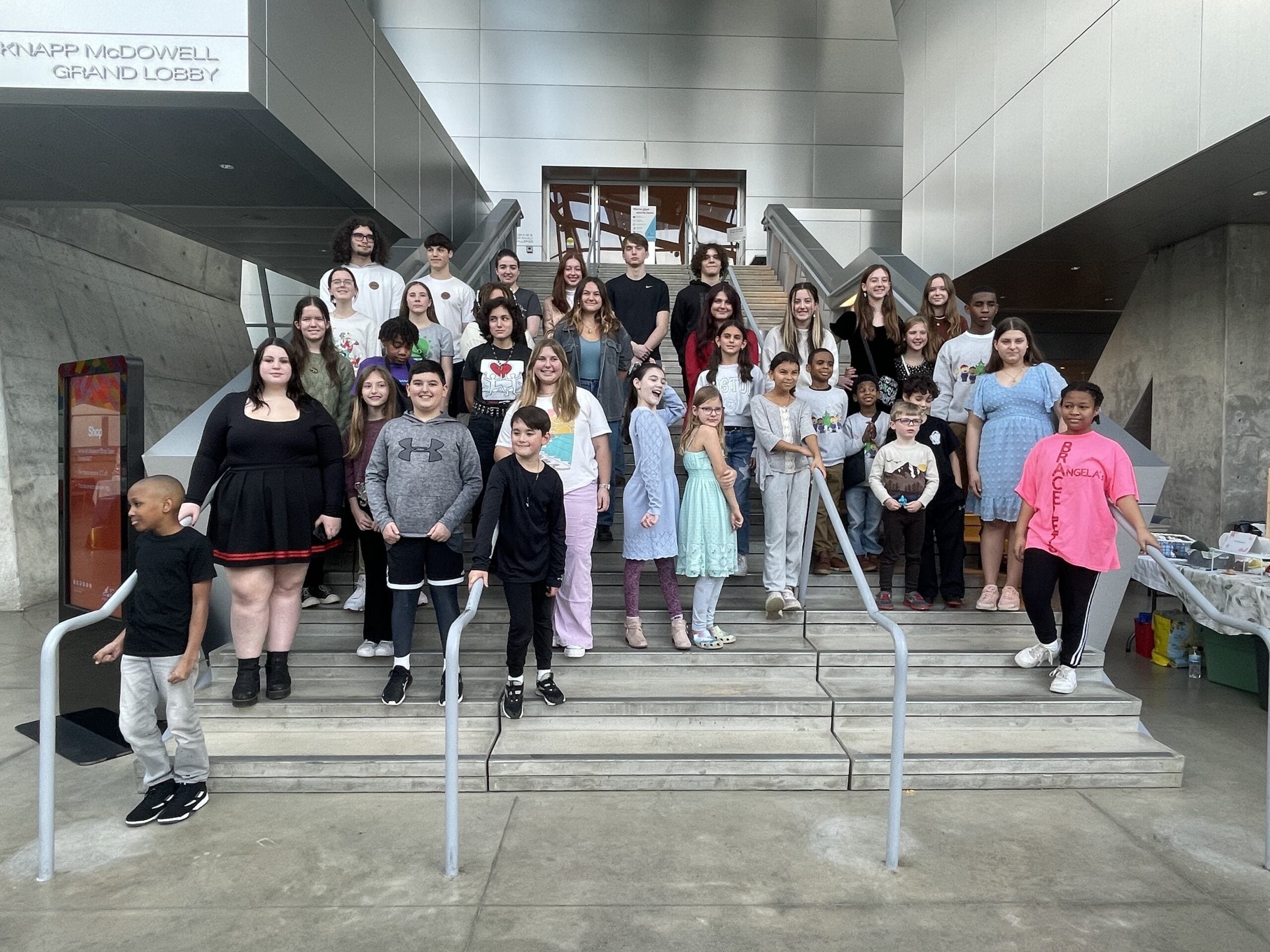 Kids in the Akron Art Museum standing on the staircase