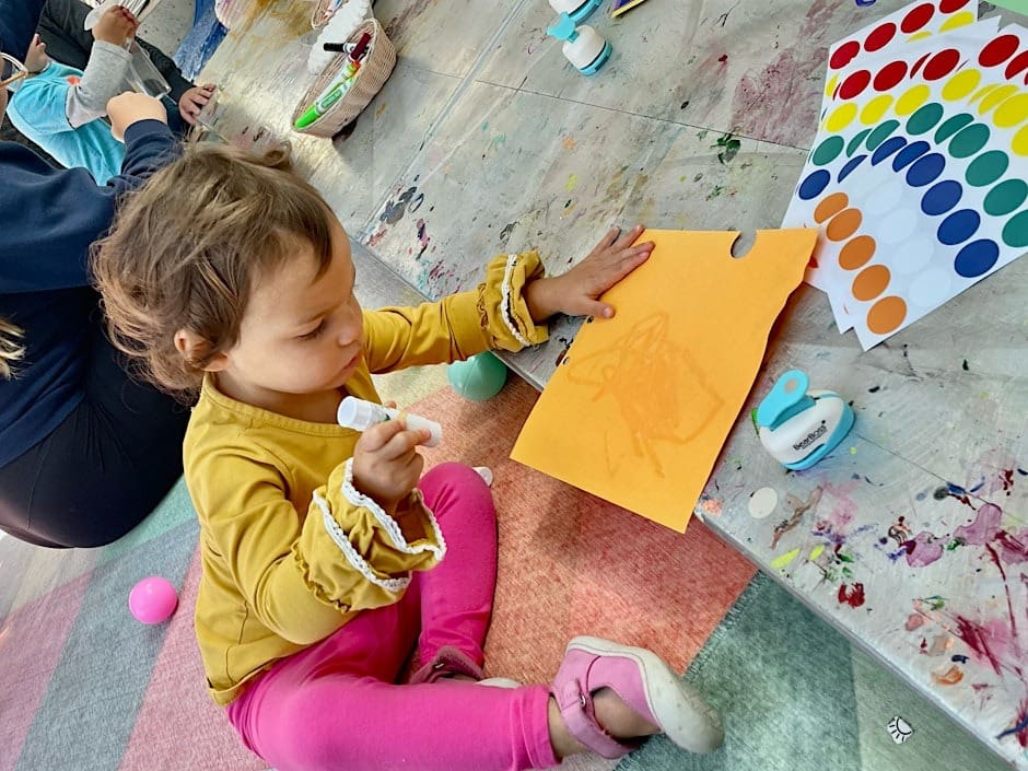 A young child working on an art project.