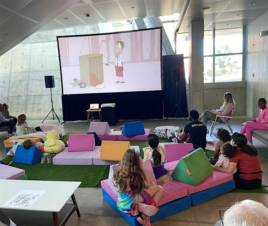 Kids watching cartoons at the Akron Art Museum