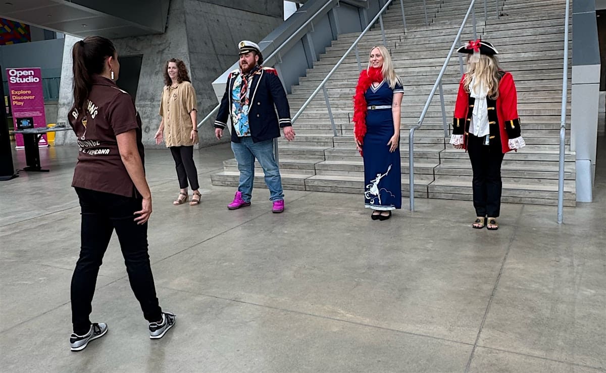 People dancing in the lobby of the Akron Art Museum