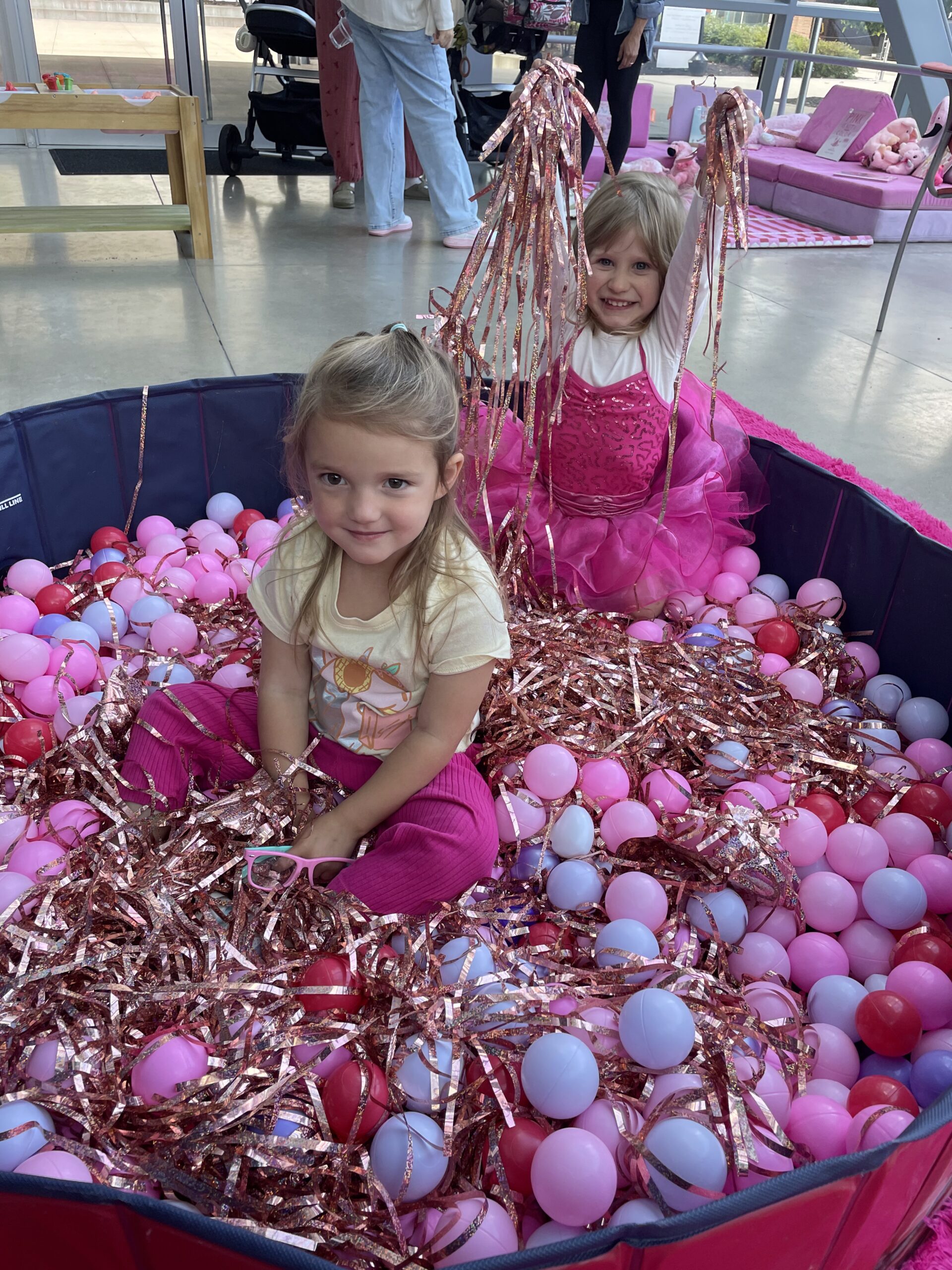 Two children playing at a family event at the Akron Art Museum